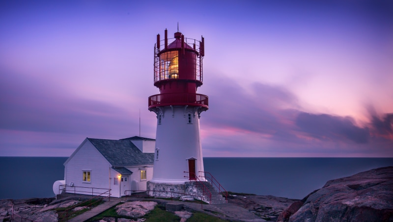 Lighthouse at dusk on the coast of Norway