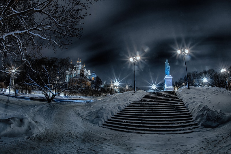 Monument and church in Smolensk, Russia at night in winter