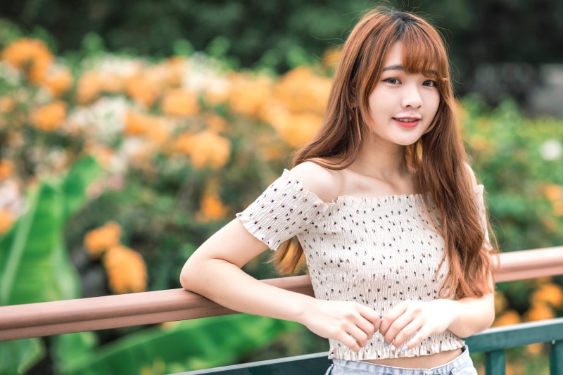 Asian woman smiling with bokeh background