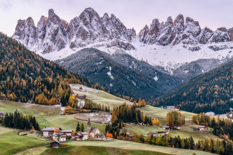 Dolomites Mountains in South Tyrol, Italy with Village and Church