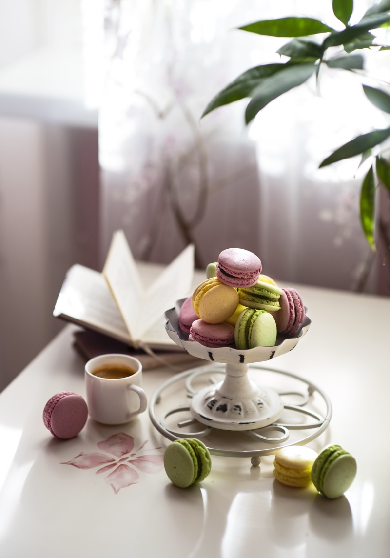Coffee cup and macarons on a table
