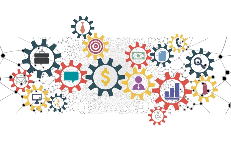 Business gears with icons representing finance, communication, and strategy