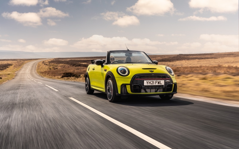 Yellow Mini John Cooper Works Cabrio on a Winding Road