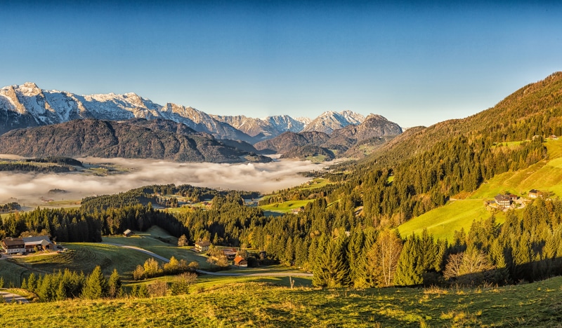 4K Austria Alps Mountains Autumn Scenery with Houses and Fog