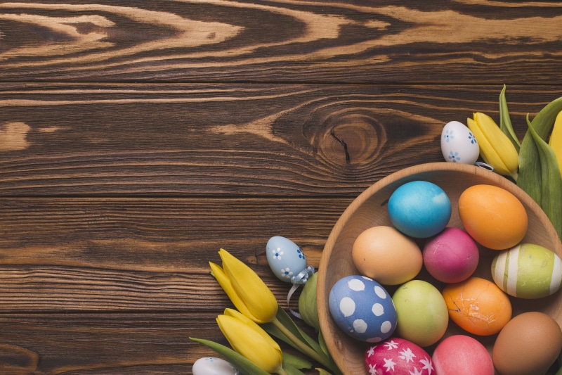 Easter Eggs and Tulips on Wood Planks