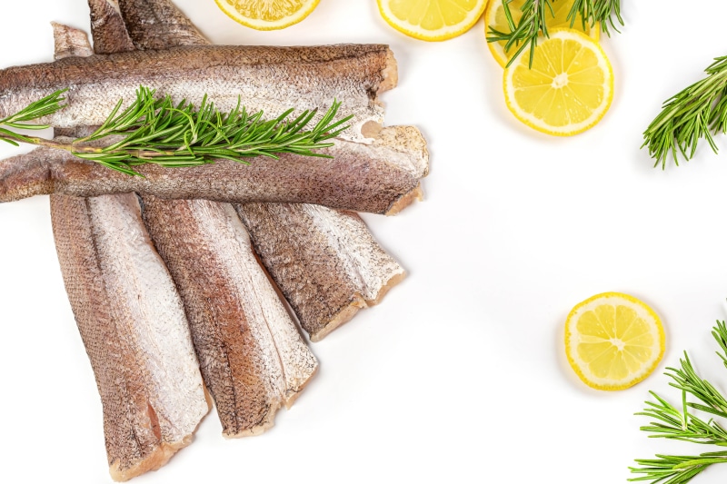 Raw fish fillets with lemon and rosemary