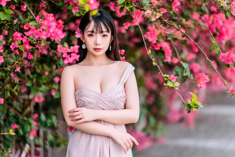Asian woman in a pink dress with flowers