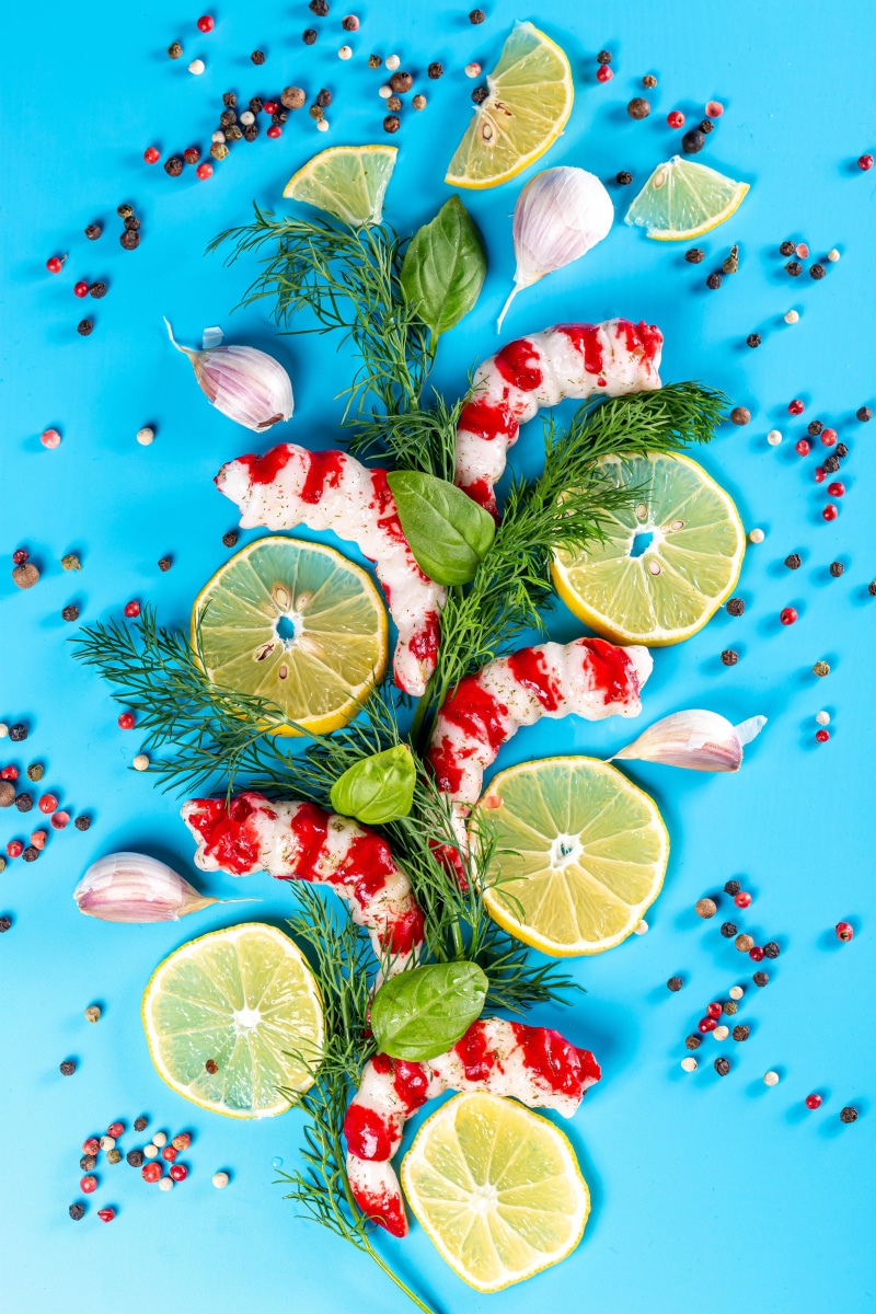 Shrimp with Lemon, Garlic, and Dill on Blue Background