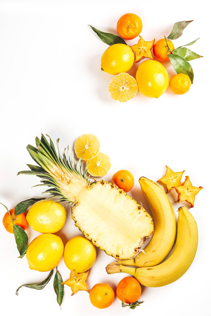 4K Assortment of Bananas, Lemons, Mandarines, and Pineapple