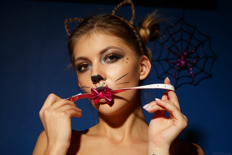 Monika Dee with cat makeup and bowknot