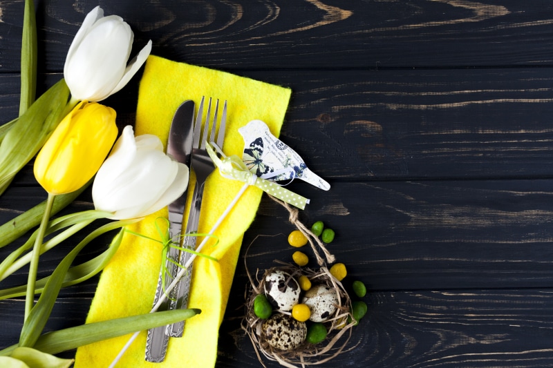 Easter table setting with tulips and eggs