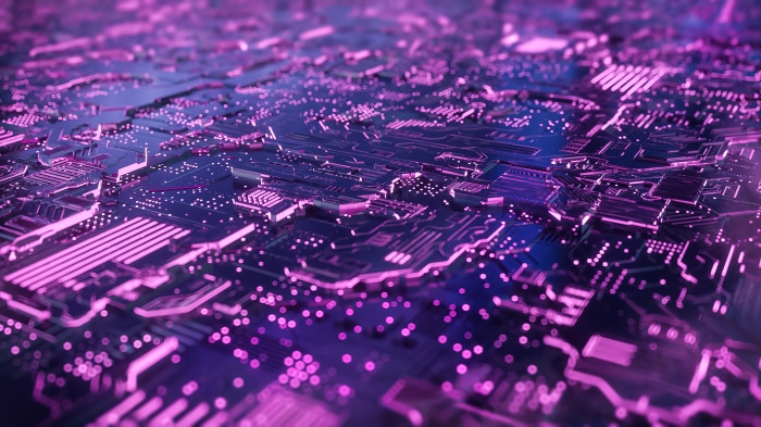 Close-up of a purple and blue circuit board with glowing lights