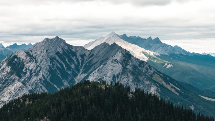 Mountain range with forest and clouds, 4K