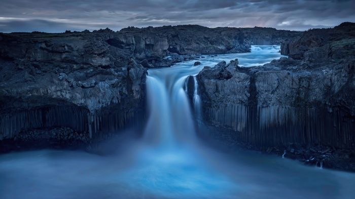 Waterfall in rocky landscape 4K