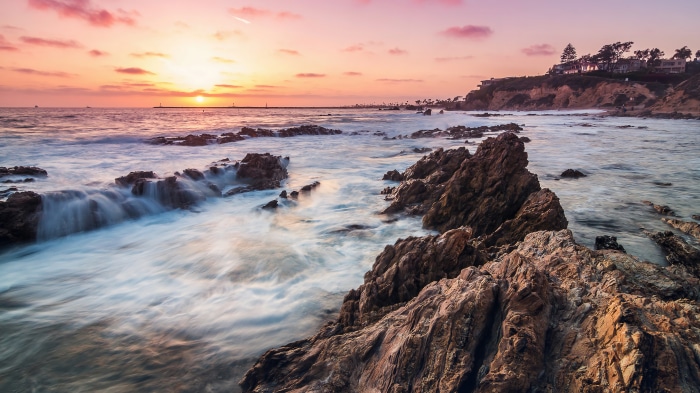 Sunset over rocky coast at Corona Del Mar, California 4K