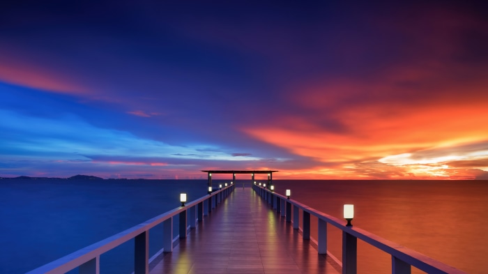 Wooden pier at sunset over the ocean 4K