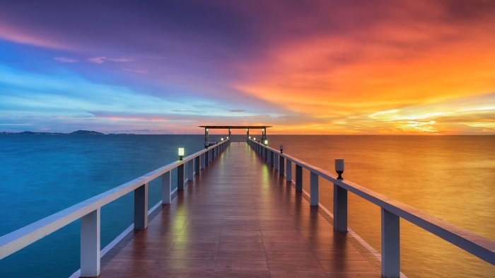 Wooden pier at sunset over the sea 4K