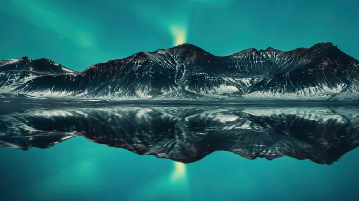 Aurora Borealis over Mountains Reflected in Lake