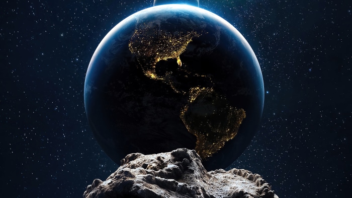 Asteroid in front of Earth in space 4K