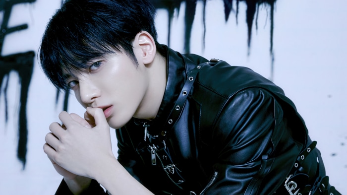 Taehyun from TXT in a black leather jacket