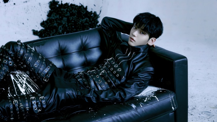 Soobin from Tomorrow X Together in black leather outfit