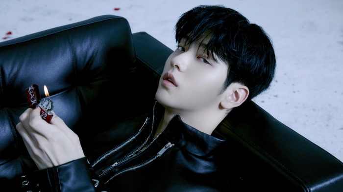 Soobin from Tomorrow X Together holding a lighter