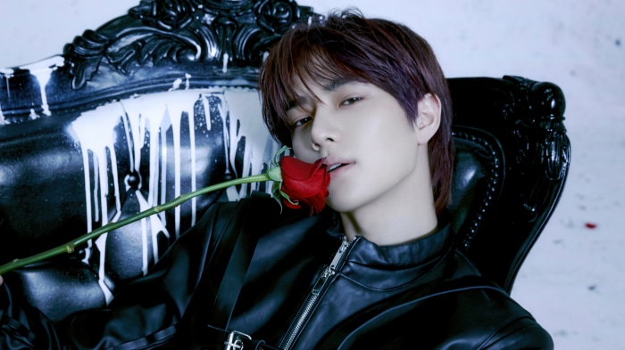 Beomgyu from Tomorrow X Together with a rose