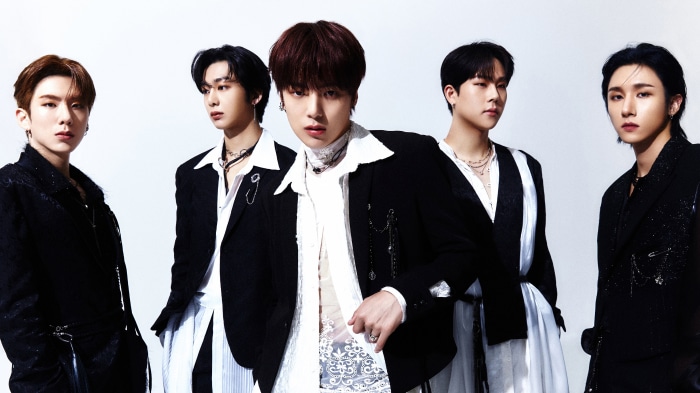 Monsta X members in black and white outfits