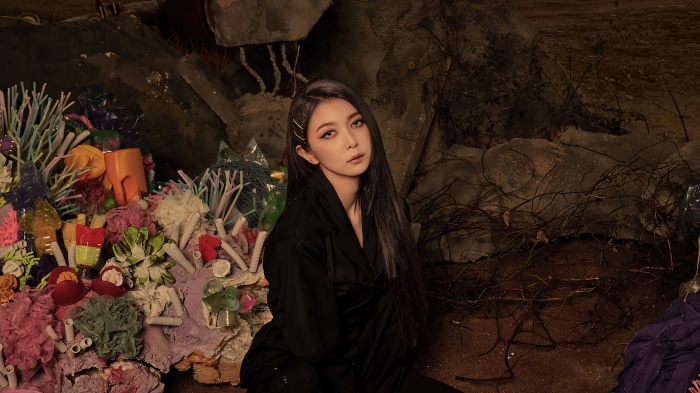 Dami from Dreamcatcher in a dark, abstract setting 4K