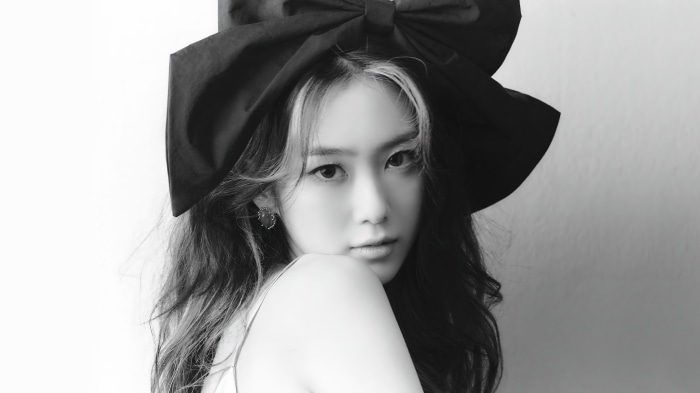 Jiho from Oh My Girl with a large bow