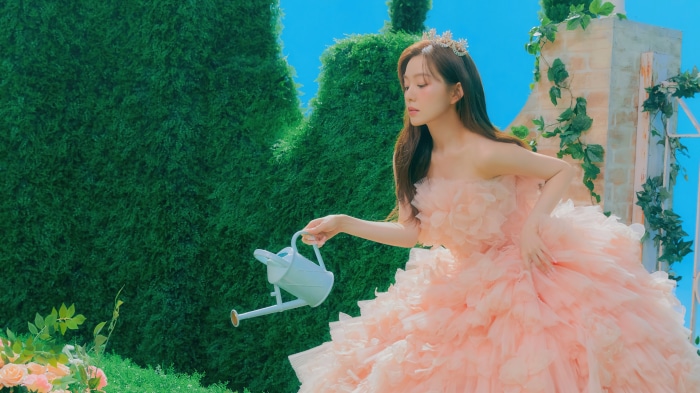 Irene from Red Velvet with a watering can