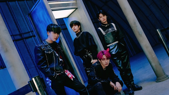 Stray Kids members in dark outfits