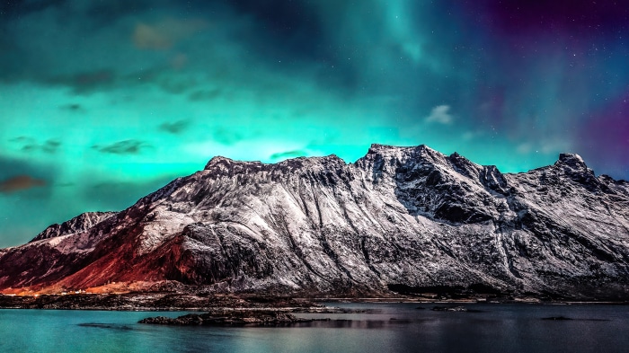 Aurora Borealis over Snowy Mountains and Lake 4K