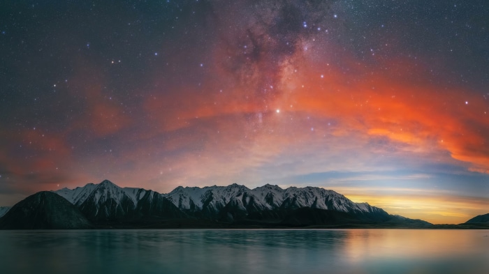 Milky Way over snow-capped mountains and lake in New Zealand 4K