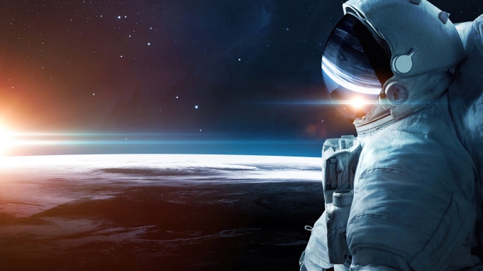 Astronaut in space with Earth and sun