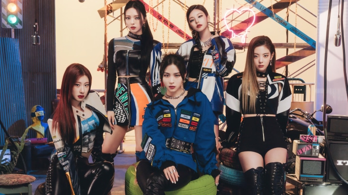 ITZY members in racing-themed outfits
