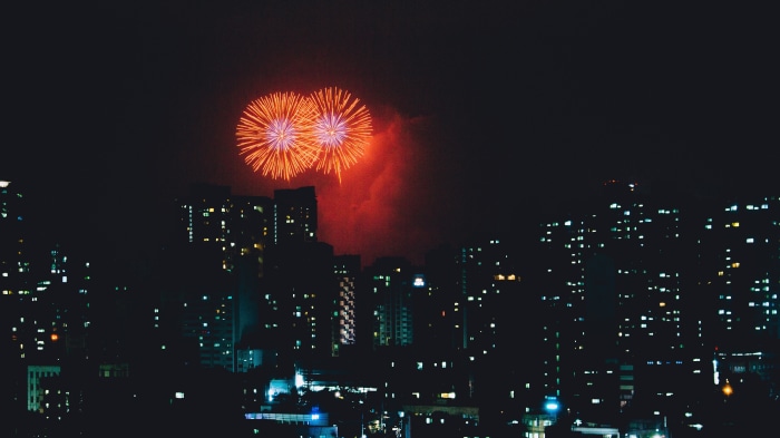 Fireworks over a city at night