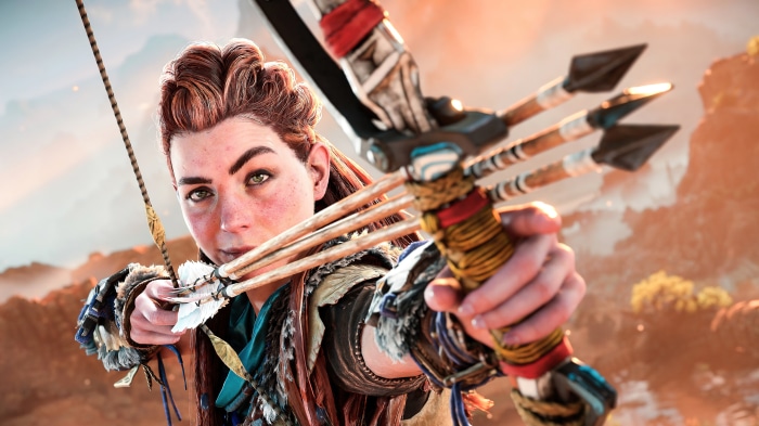 Aloy from Horizon Forbidden West aiming a bow