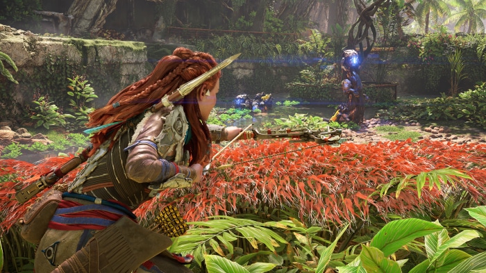Aloy from Horizon Forbidden West aiming a bow