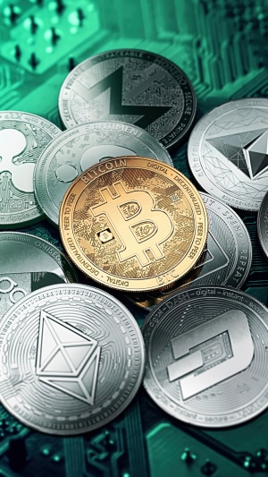 Bitcoin, Ethereum, and other cryptocurrencies on a circuit board