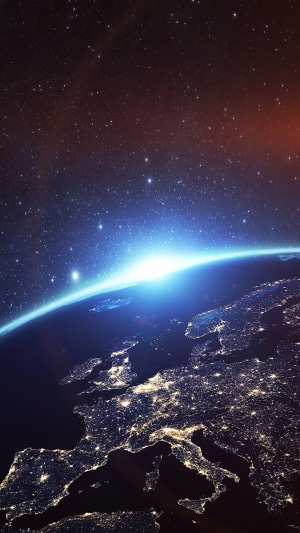 Earth from space with city lights and stars
