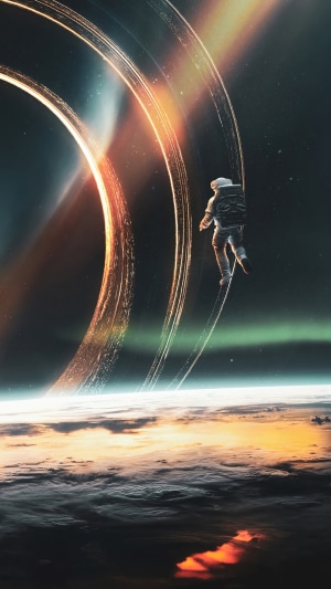 Astronaut floating near a ringed planet