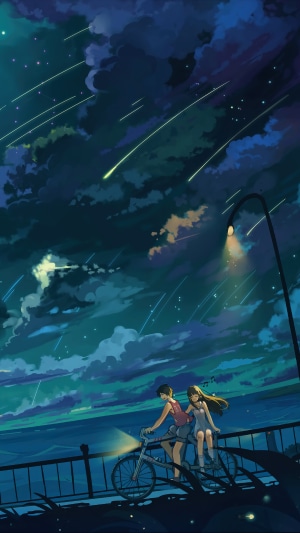 Couple biking at night under shooting stars