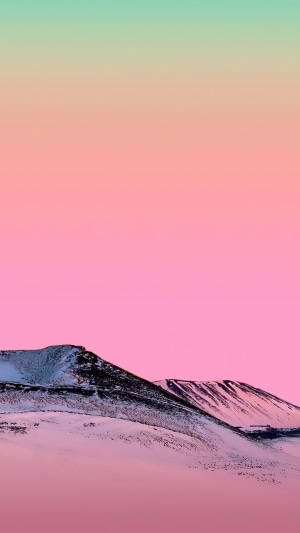 Snowy mountains under a gradient sky