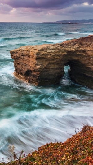 Natural Archway in the Ocean at Sunset, California