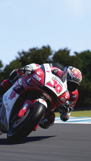Motorcycle racer in red and white suit on track