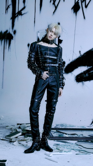 Yeonjun from TXT in a black leather outfit