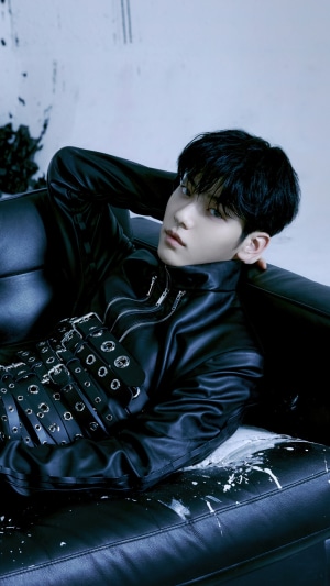 Soobin from TXT in a black leather outfit