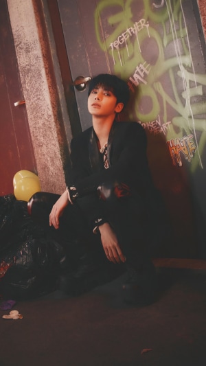 Taehyun from TXT in a dark alley
