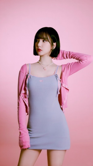 Eunha from VIVIZ in a blue dress and pink cardigan